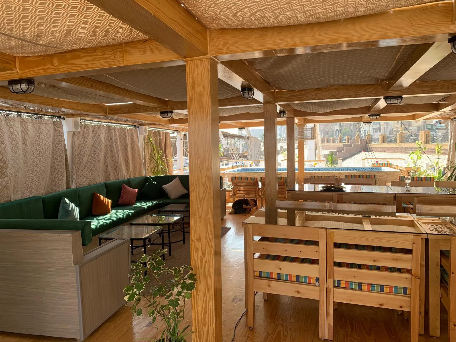 Guests relaxing on the Dahabeya open-air deck